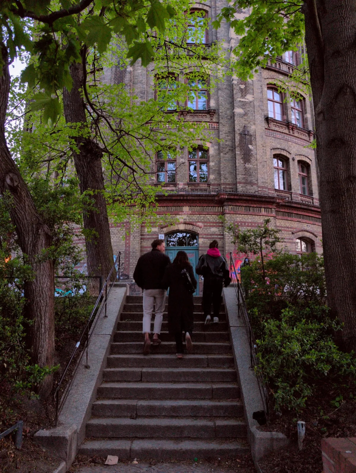 A brick courtyard entrance in Berlin photographed with the Golden Hour film look, captured in-camera with Lvma